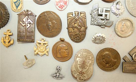 A large collection of various German Third Reich badges,
